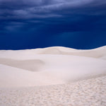 Dune Blue – fine art photograph of a deep indigo storm sky over the white dunes of White Sands National Park, New Mexico, by Aaron Chang