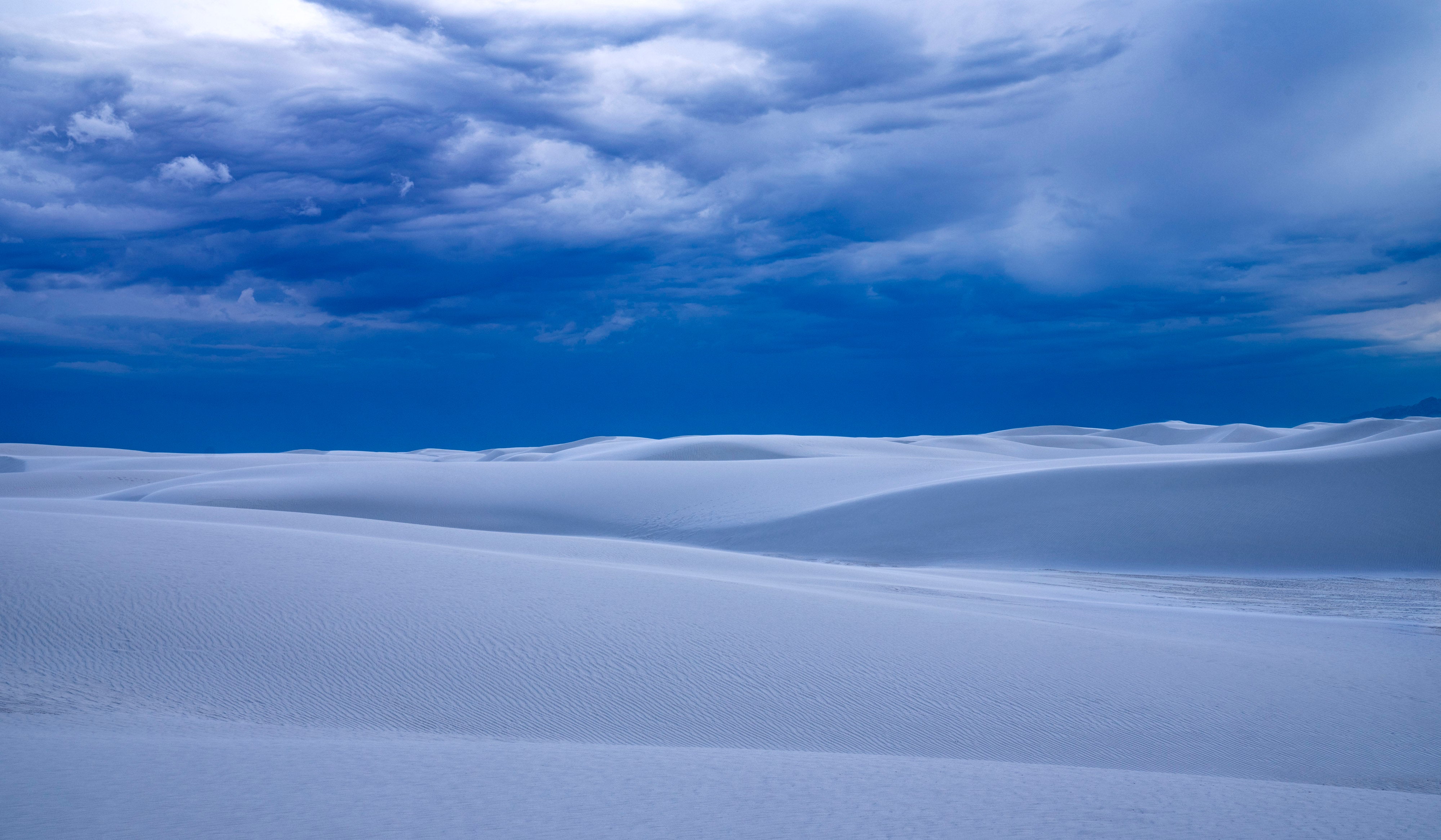 Dune Storm – fine art photograph of storm clouds over the white dunes of White Sands National Park, New Mexico, by Aaron Chang