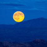 Moab Moon – fine art photograph of a full moon rising over the La Sal Mountains outside Moab, Utah, by Aaron Chang