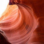 Stone Wave – fine art photograph of sandstone curling over like a breaking wave inside a slot canyon in northern Arizona, by Aaron Chang