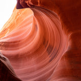 Stone Wave – fine art photograph of sandstone curling over like a breaking wave inside a slot canyon in northern Arizona, by Aaron Chang