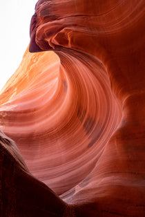 Stone Wave – fine art photograph of sandstone curling over like a breaking wave inside a slot canyon in northern Arizona, by Aaron Chang