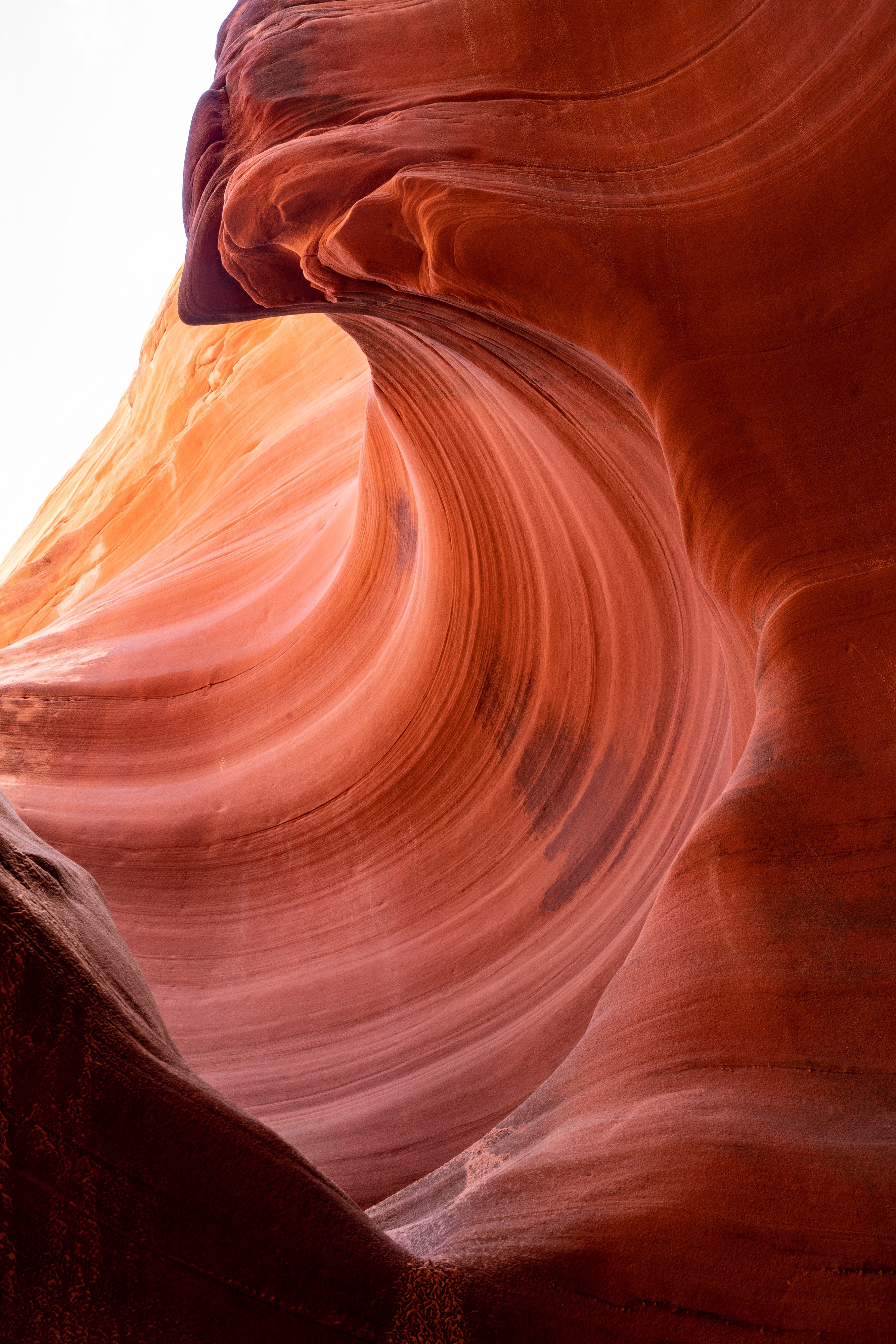 Stone Wave – fine art photograph of sandstone curling over like a breaking wave inside a slot canyon in northern Arizona, by Aaron Chang