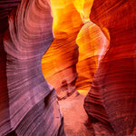 Rattlesnake Canyon – fine art photograph of a narrow sandstone passage glowing orange in Rattlesnake Canyon near Page, Arizona, by Aaron Chang