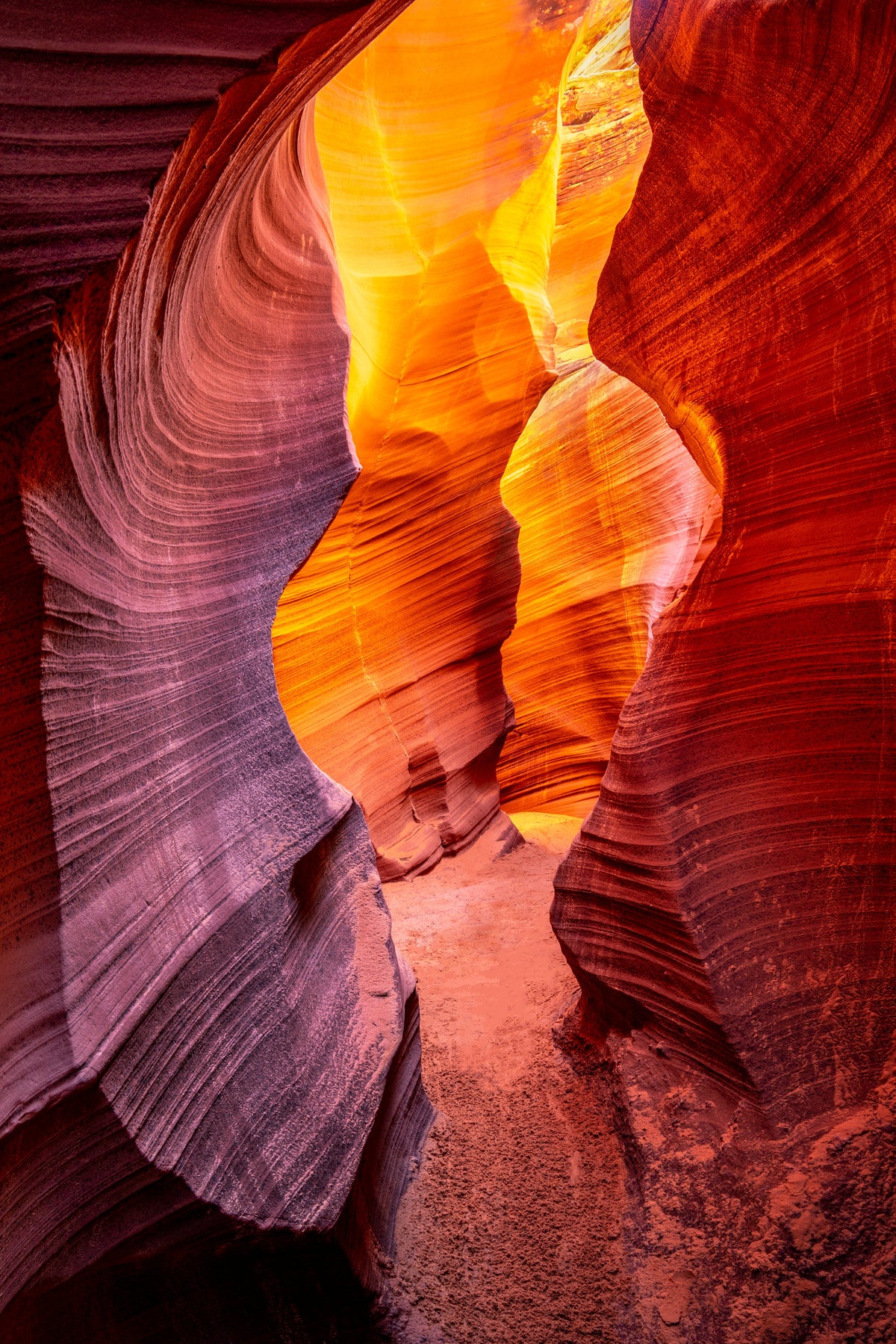 Rattlesnake Canyon – fine art photograph of a narrow sandstone passage glowing orange in Rattlesnake Canyon near Page, Arizona, by Aaron Chang