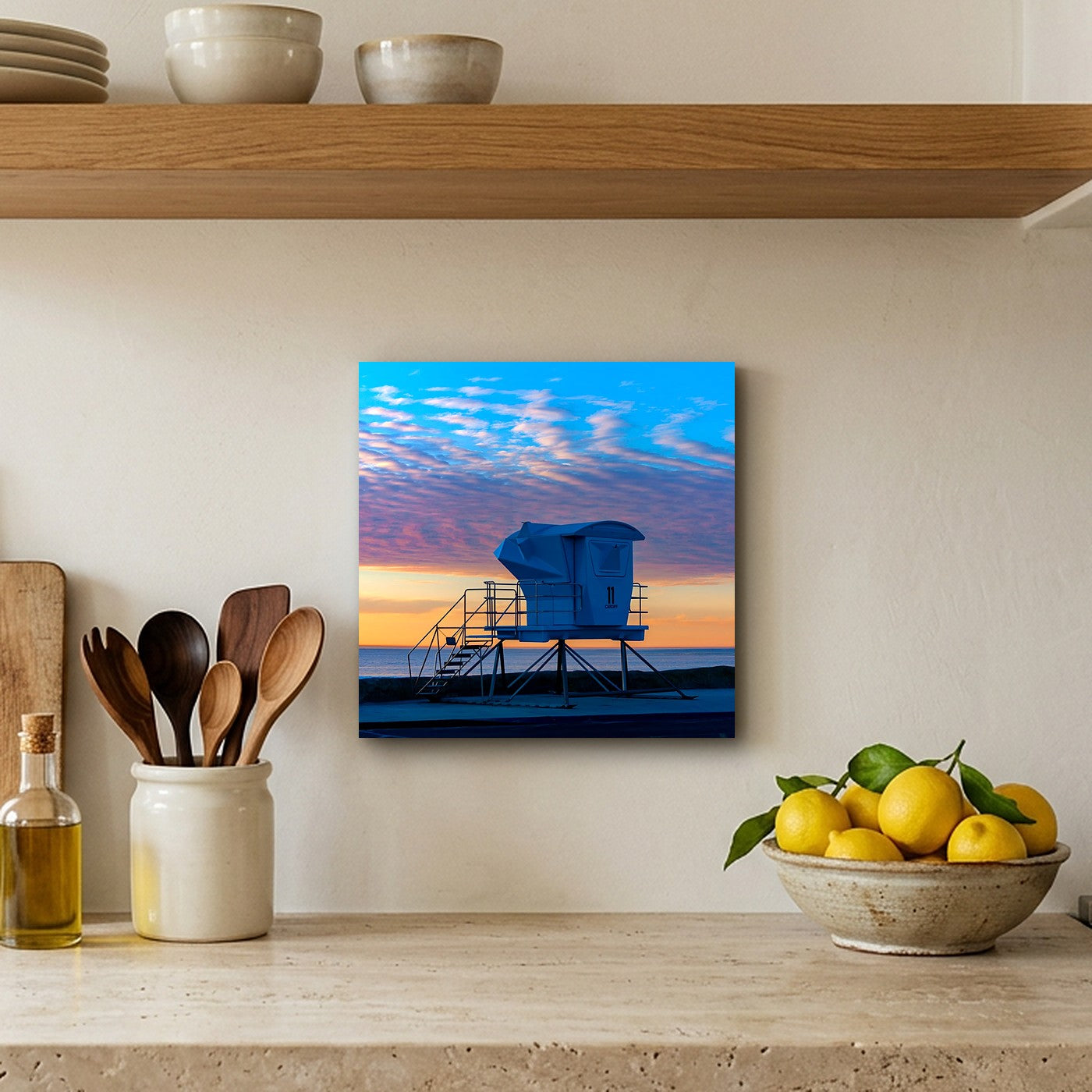 Lifeguard Tower 12" x 12" wall art in a travertine kitchen