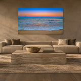 Pastel Beach by Aaron Chang over a long sofa in a plaster living room