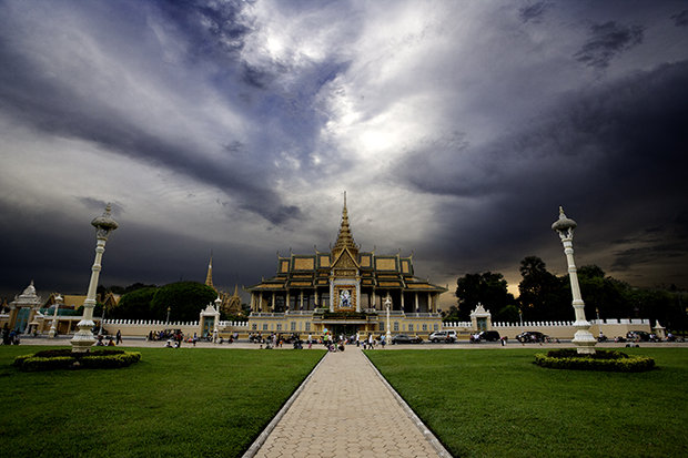 On the banks of the Mekong river, the palace stares down upon the people.