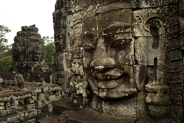 This iconic image reads Cambodia. Carved in the 12th century and still standing guard today.